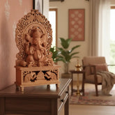 Wooden deity statue with intricate carvings on a white background