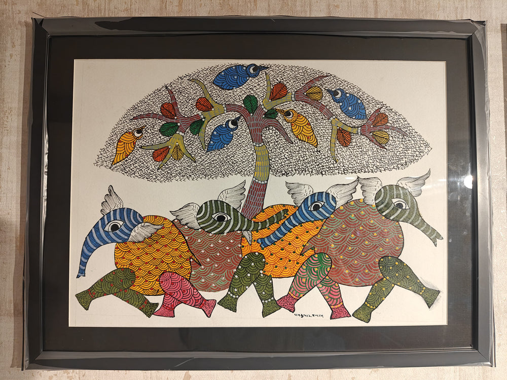 Framed artwork with colorful abstract design of animals and a tree