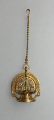 Decorative gold hanging object on a gray background