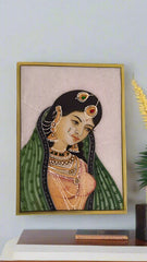 Framed artwork of a traditional portrait with jewelry on a light background