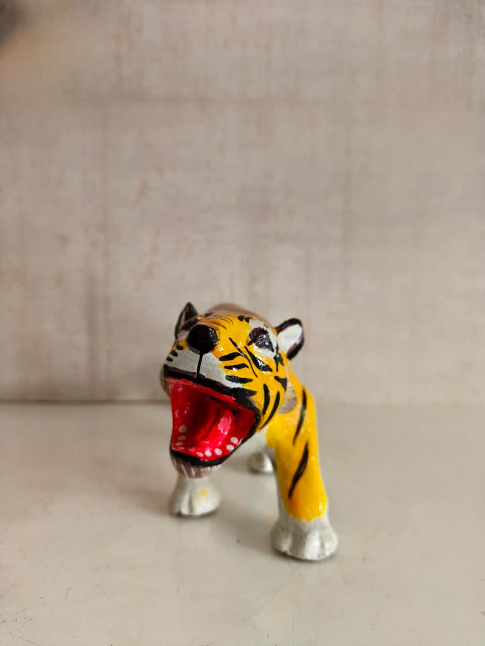 Traditional Nirmal art wooden tiger figurine with yellow and black lacquer finish