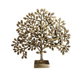Antique brass kalpavrisham sculpture on a table, by Krafteria.