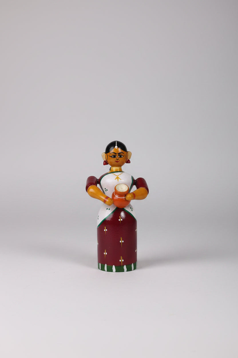Handmade Etikoppaka wooden doll for home decor.