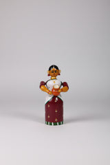 Handmade Etikoppaka wooden doll for home decor.