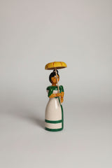 Traditional Etikoppaka wooden doll with umbrella, a charming home decor piece.
