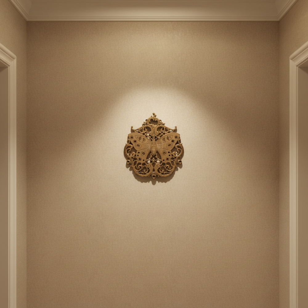 Vintage brass butterfly wall decor with filigree medallion detail.