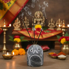 Decorative stone with holes on a white background, branded 'Krafteria'.