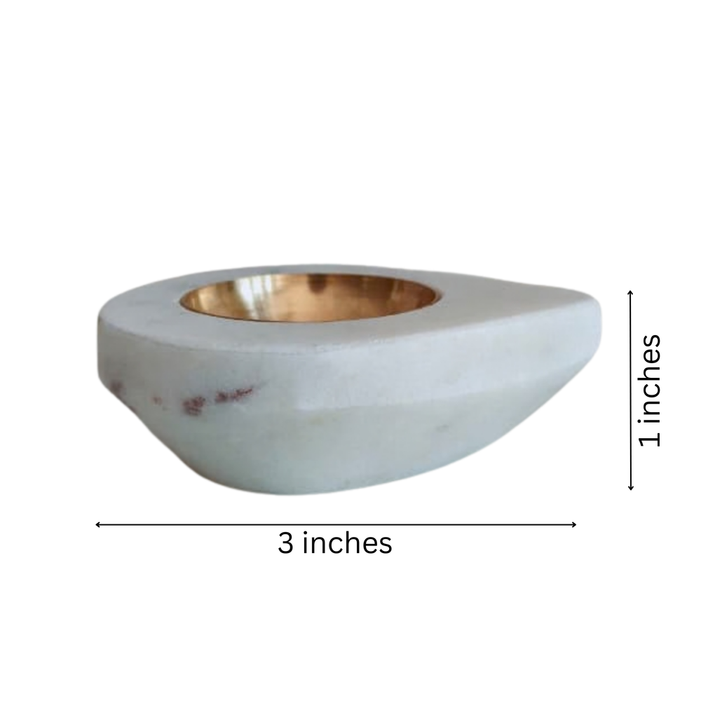 Elegant white marble deepam for festive celebrations.