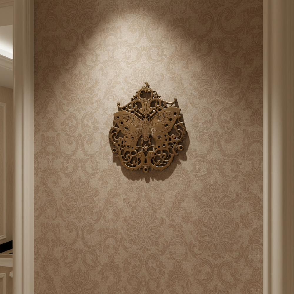 Vintage brass butterfly wall decor with intricate filigree medallion detailing.