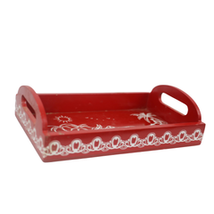 Handcrafted wooden cow print tray with vibrant red background