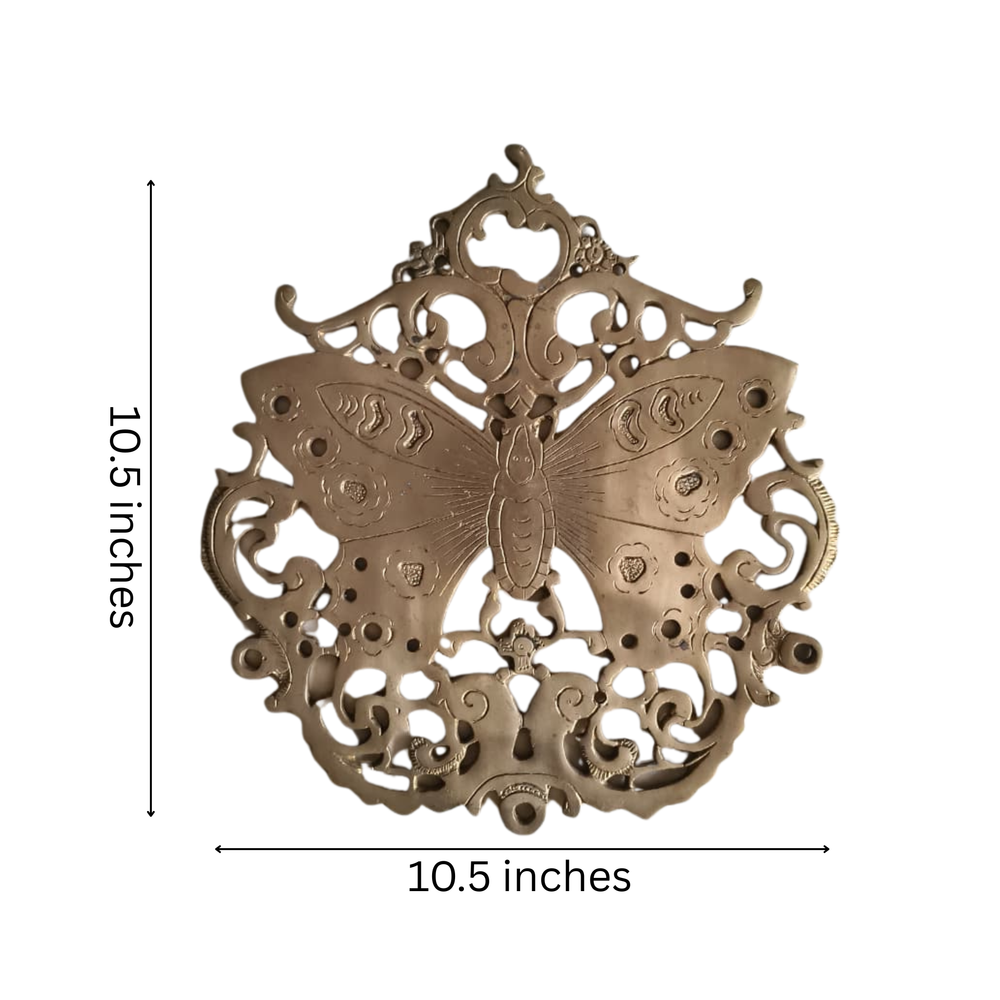 Vintage-style brass butterfly wall decor, a filigree medallion brass wall art piece.