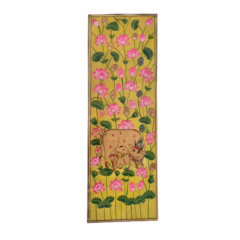 Decorative Pichwai panel with a cow and pink flowers on a yellow background