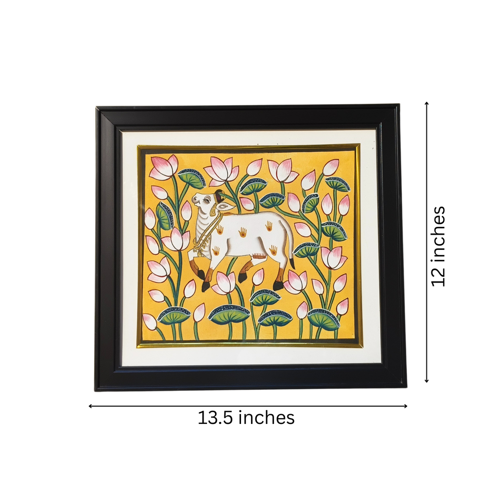 Pichwai Framed artwork of a cow among flowers with dimensions indicated