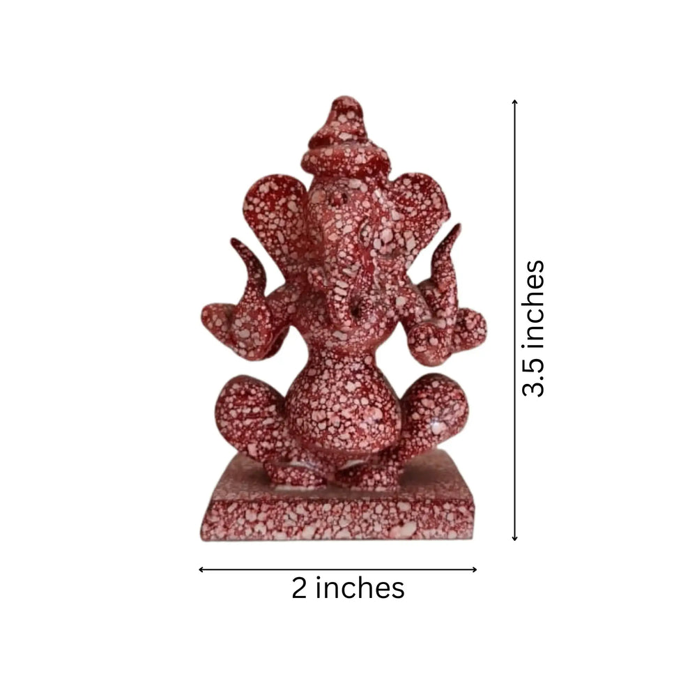 Decorative double-sided Ganpati idol in rich red marble finish.
