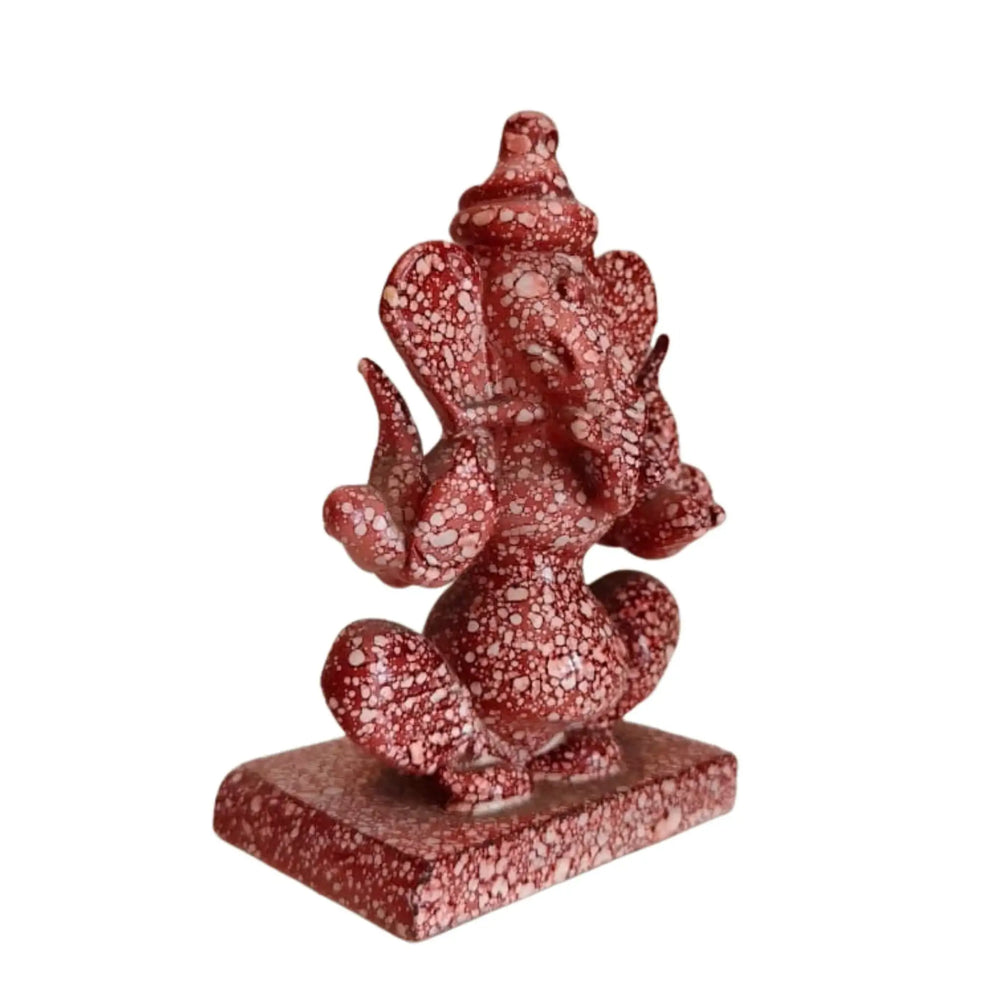 Red marble Ganesh idol carved on both sides for home décor.