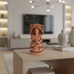 Reversible hand-carved wooden statue depicting a meditating Buddha on one side and an intricate Bodhi Tree design on the other, against a light background.