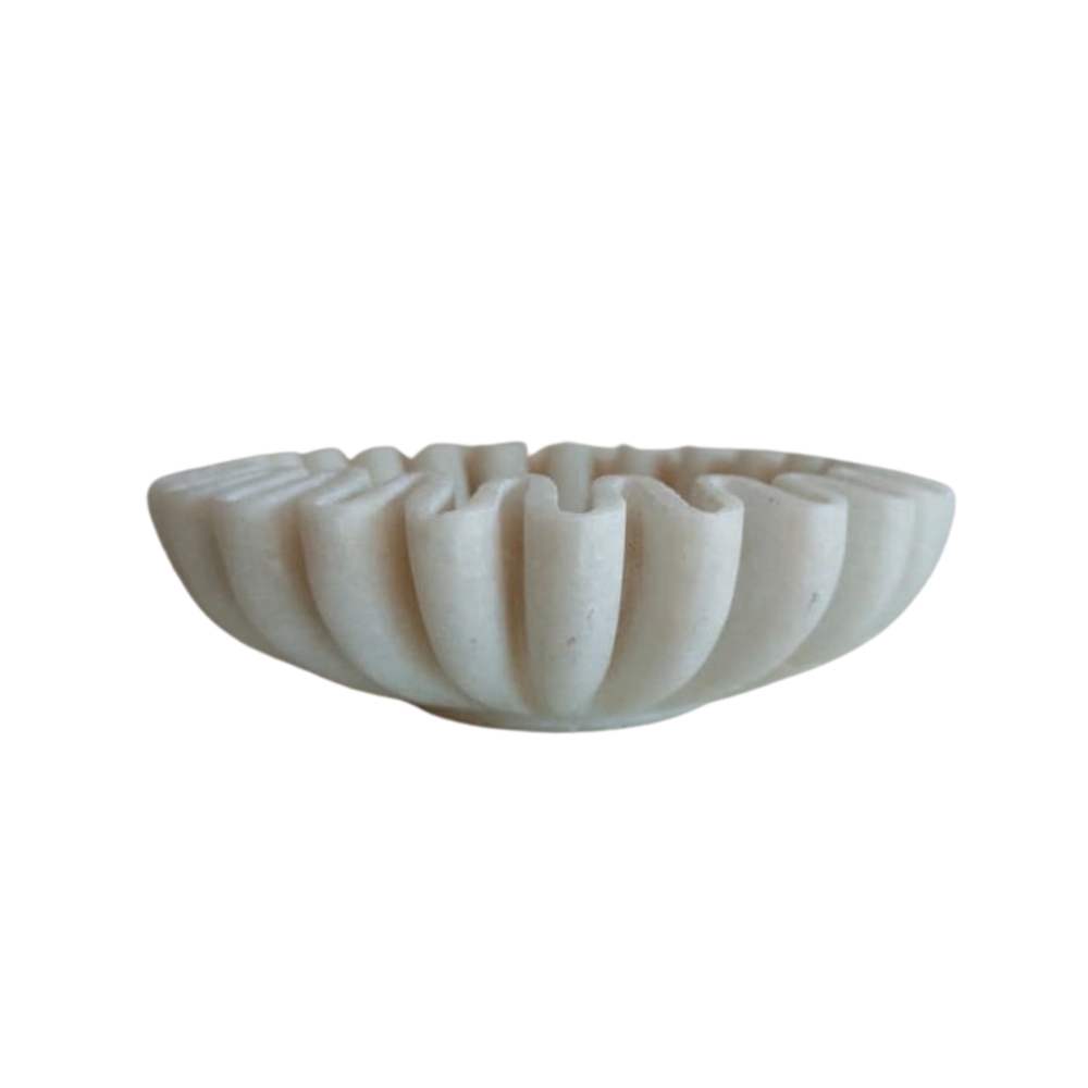Decorative white marble bowl with artistic ruffled border.