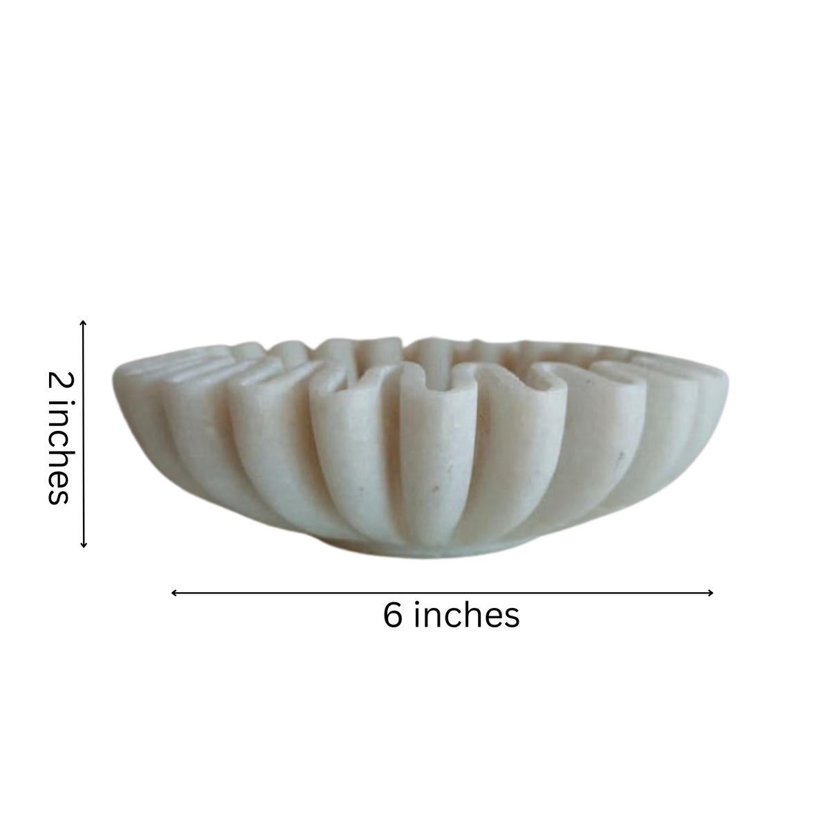 Modern marble accent bowl with fluted ruffle design.