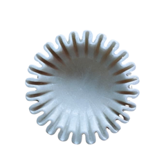 Luxury marble centerpiece bowl with soft wavy rim detailing.