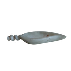 White marble urli bowl used as fruit bowl and décor accent.