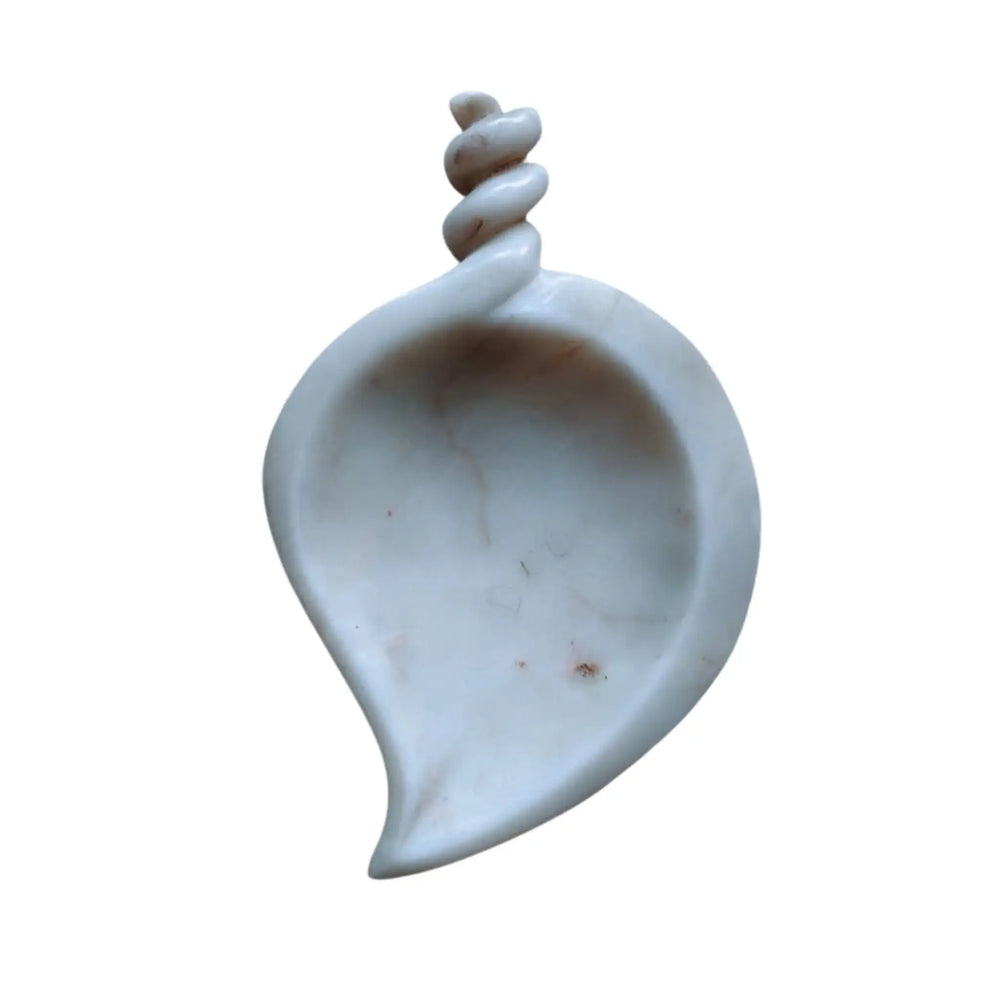 Decorative marble urli bowl for floating flowers and candles.
