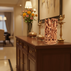 Hand-carved wooden Radha Krishna sculpture with flute and peacock detail showcasing intricate traditional craftsmanship