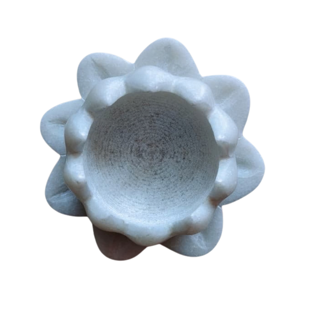 Carved marble lotus candle stand with layered petal design.
