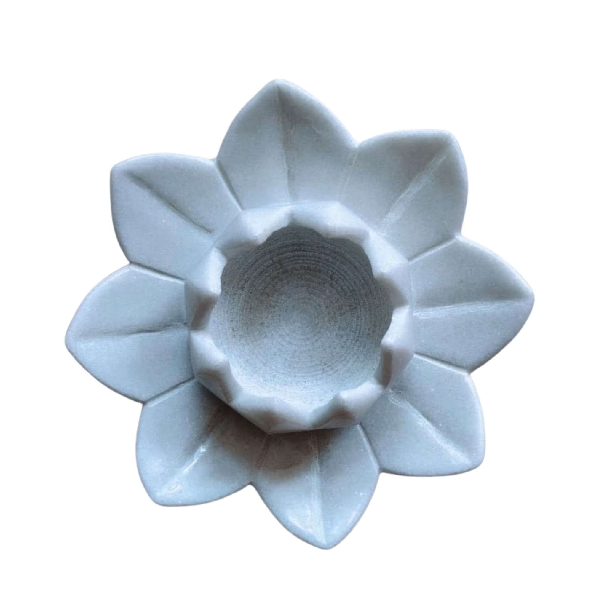 Decorative lotus-shaped marble candle holder for pooja room.