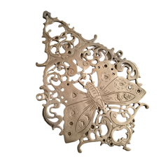 Vintage-style brass butterfly wall decor with intricate filigree detailing.