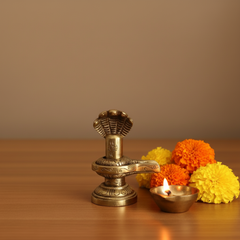 Sacred Brass Shiva Lingam and Yoni Pitha Adorned with Multi-Hooded Naga