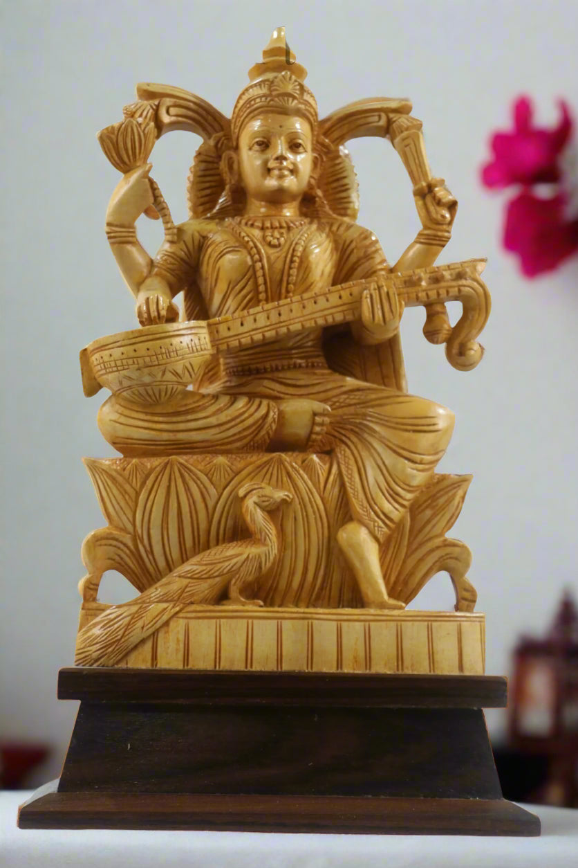 Gold-colored statue of a deity playing a stringed instrument on a wooden base, with 'Kraftopia' branding.