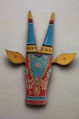 Decorative item with colorful patterns on a textured beige background