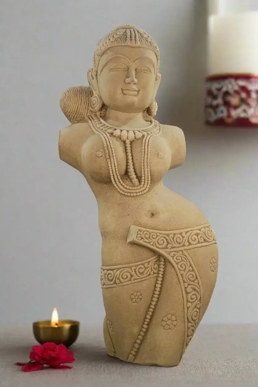 Sand Stone statue of a woman with intricate designs on a neutral background
