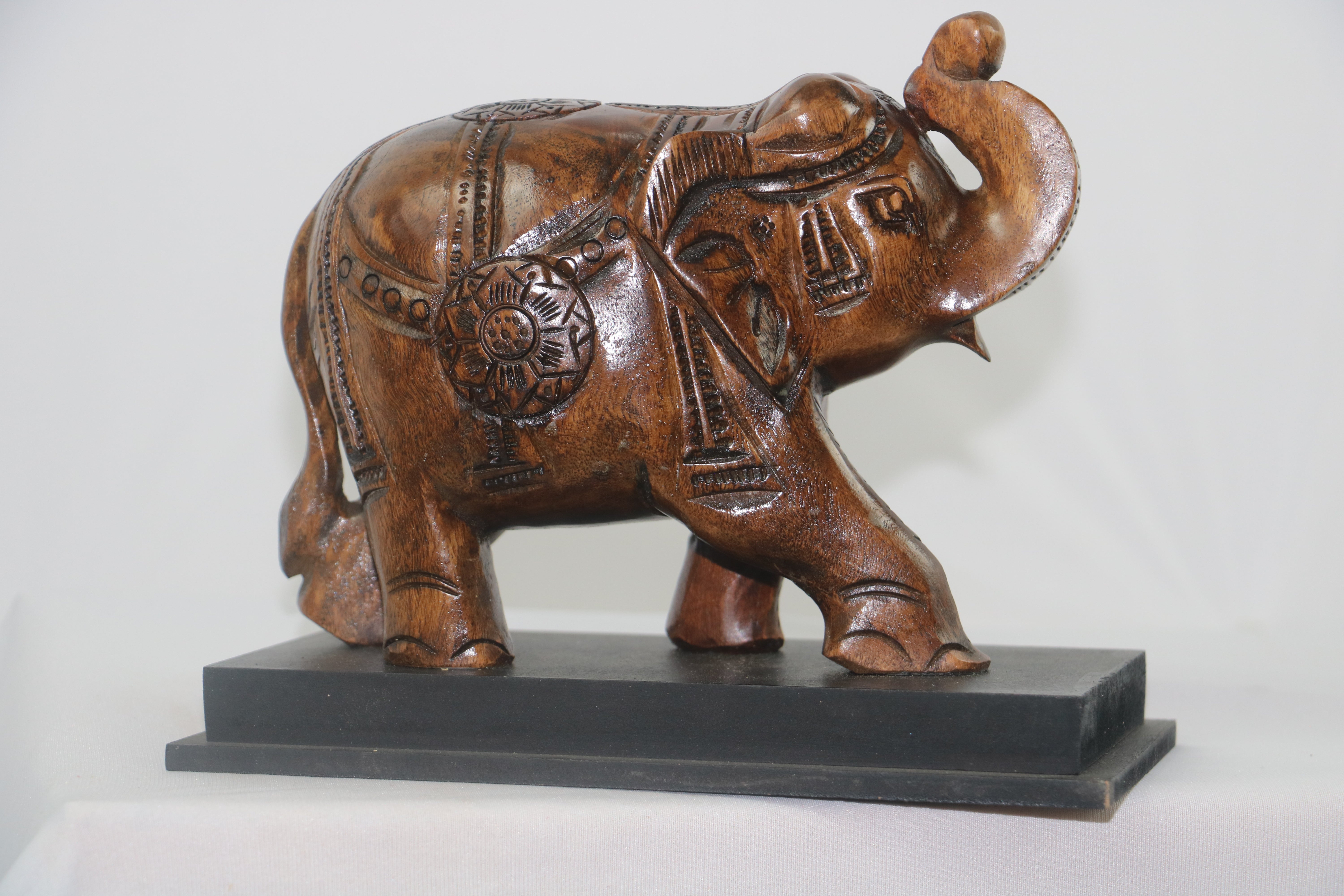 Hand-Carved Wooden Elephant with Base – Elegant Decorative Figurine