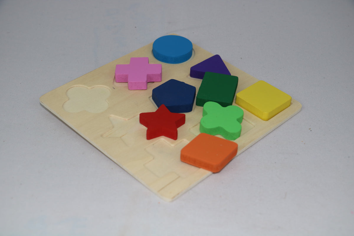 Colorful wooden shape puzzle on a light gray background