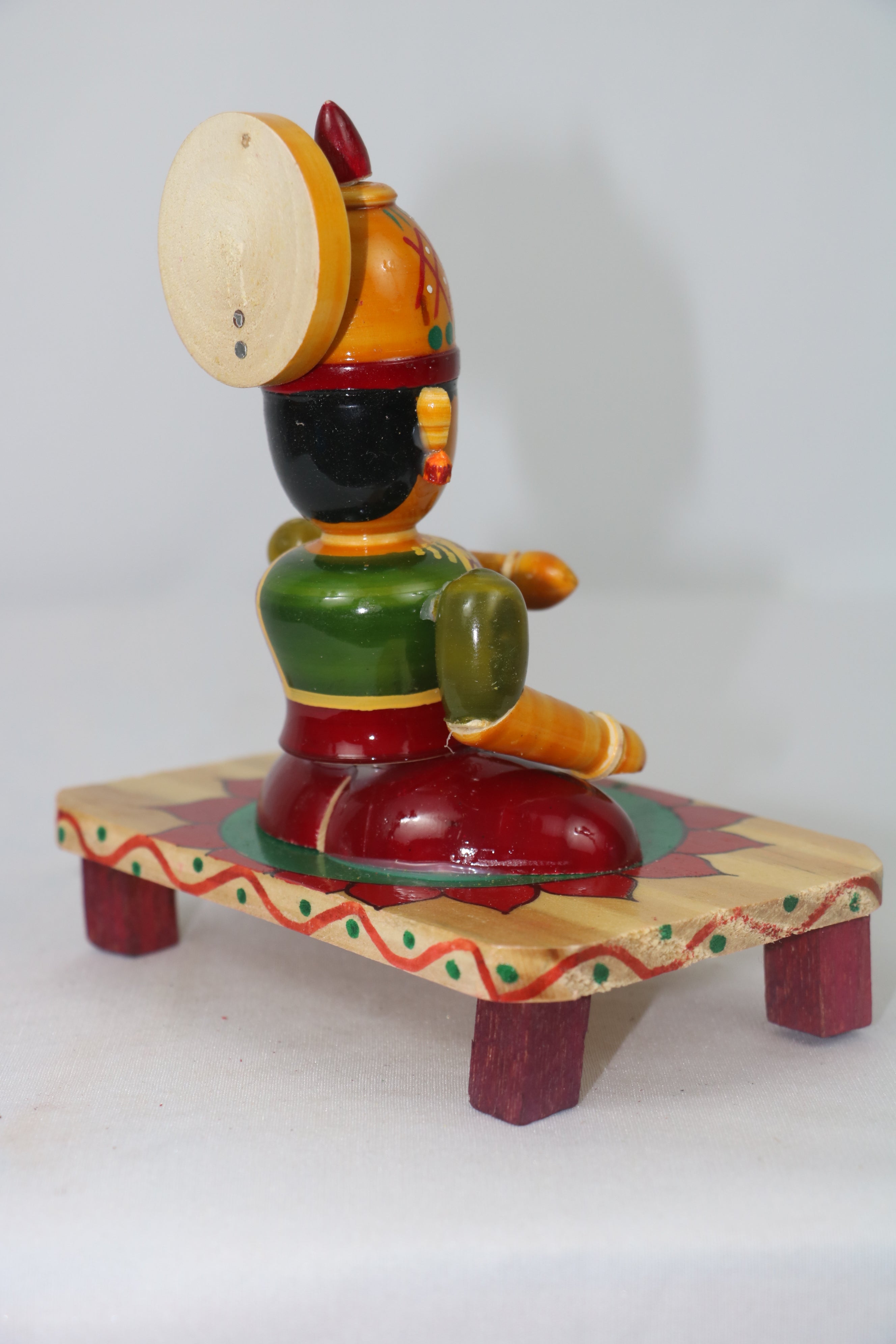 Devi Eating Sitting on Base