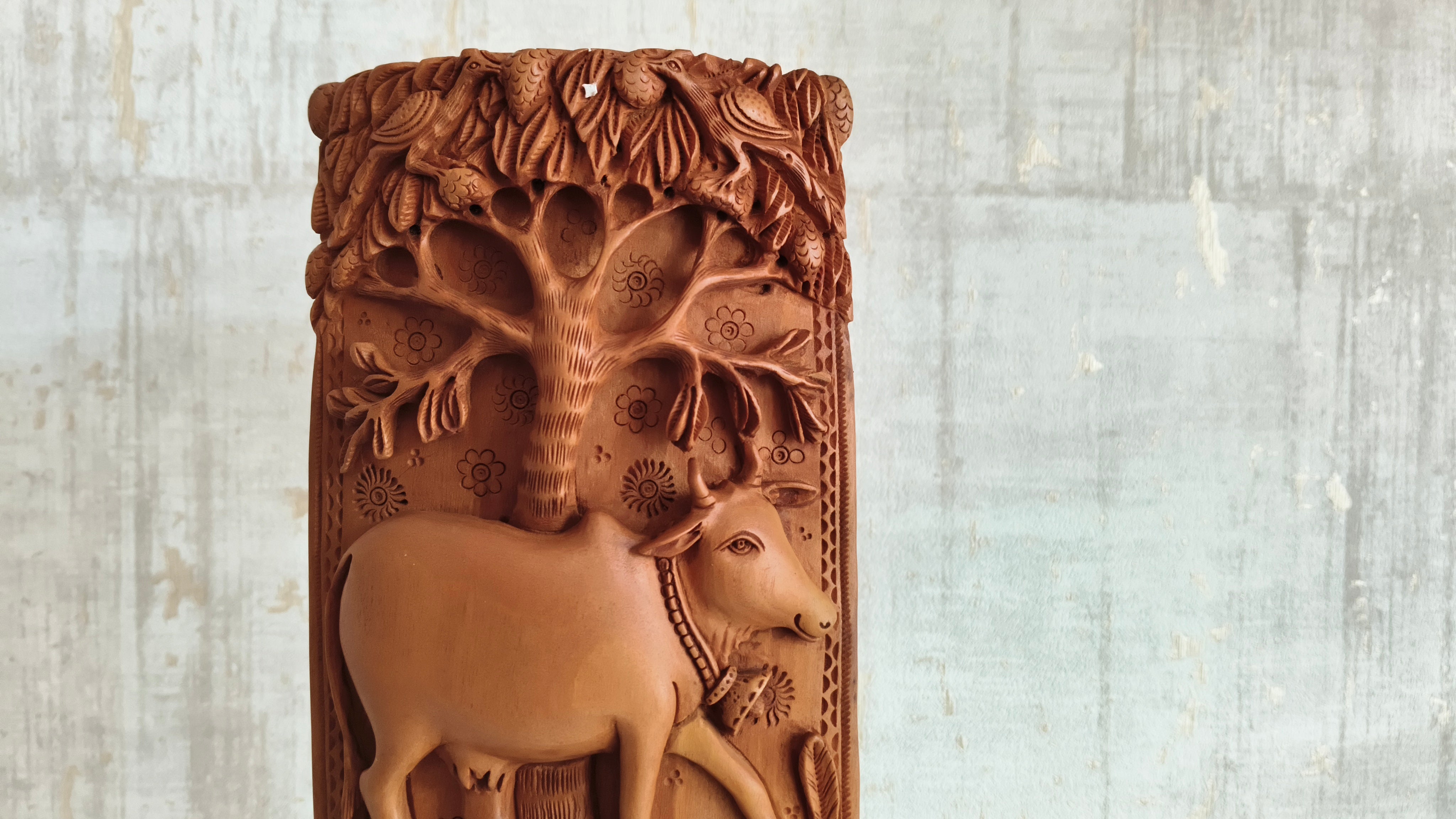 Intricate Cylindrical Wooden Carving with Ganesha and Sacred Cow Scenes