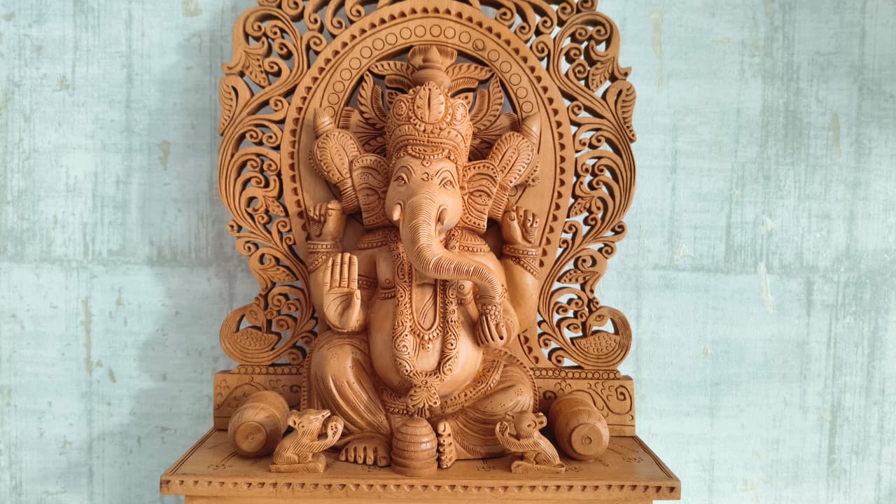 Grand Hand-Carved Wooden Ganesha Sculpture on Pedestal with Prabhavali and Mushaks