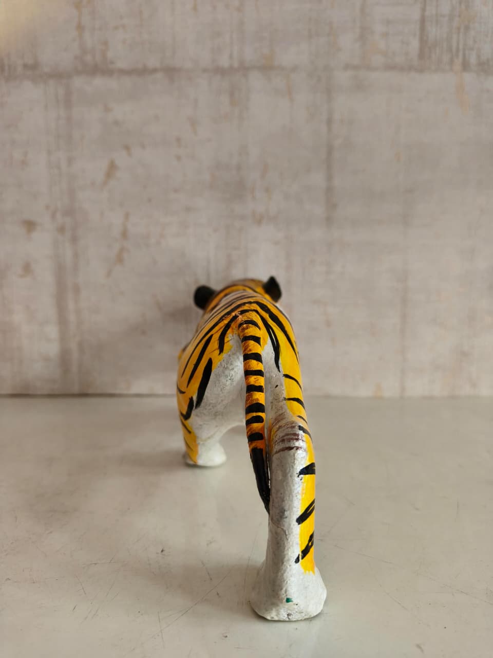 Artisan-made Nirmal wooden tiger with detailed hand-painted folk art design