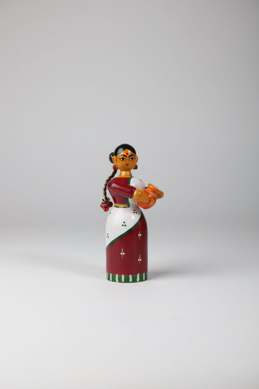 Handmade Etikoppaka wooden doll for home decor and gifts.