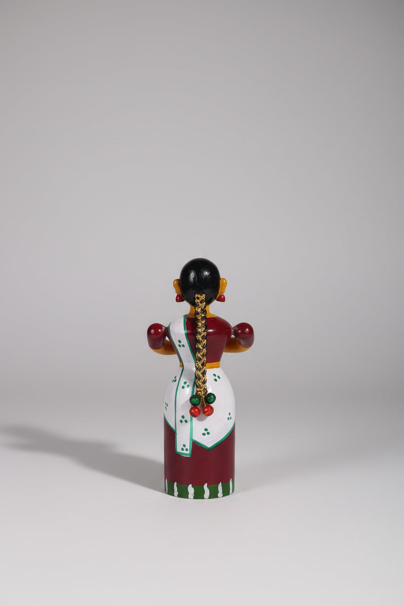 Handcrafted Etikoppaka wooden doll, perfect for home decor and gifts.